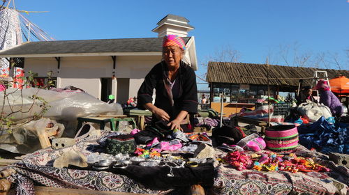 Midsection of woman at market stall