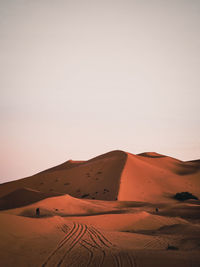 Scenic view of desert against clear sky