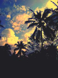 Low angle view of silhouette palm trees against sky during sunset