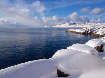 Scenic view of sea against sky during winter