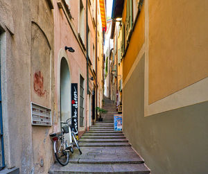 Narrow alley amidst buildings in city