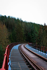 Railroad tracks against clear sky