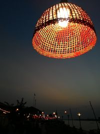 Low angle view of illuminated ferris wheel