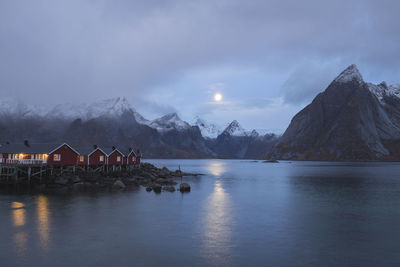 Panoramic view of lake and buildings against sky