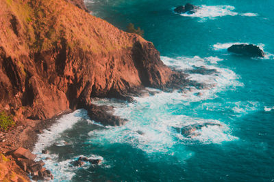 High angle view of rocks in sea