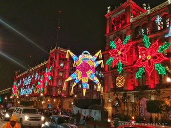 Low angle view of illuminated building at night