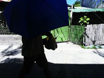 Woman standing on footpath