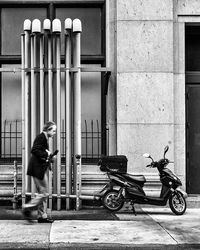 Man walking on zebra crossing in city