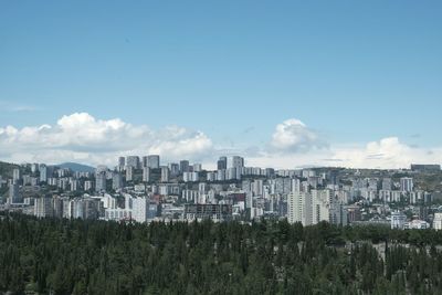 Cityscape against blue sky