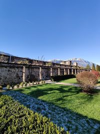 View of old ruins against clear blue sky