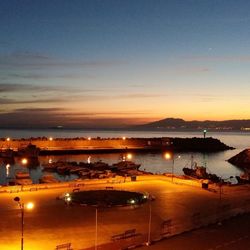 High angle view of harbor against cloudy sky