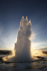 View of hot spring against sky during sunset