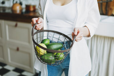 Midsection of woman holding food