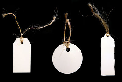 Close-up of lighting equipment hanging against black background