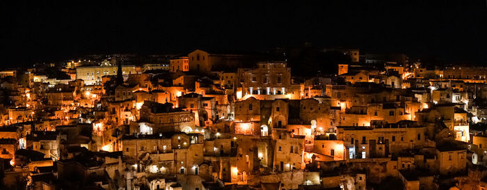 High angle view of illuminated buildings in city at night