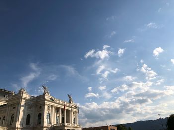 Low angle view of buildings against blue sky