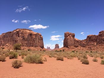 Rock formations on landscape against sky