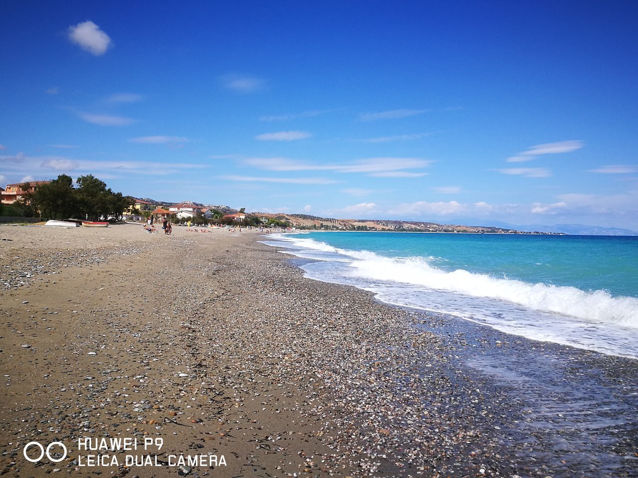 BEACH AGAINST BLUE SKY