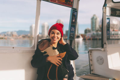 Portrait of smiling young woman standing outdoors