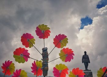 Low angle view of multi colored flowers against sky