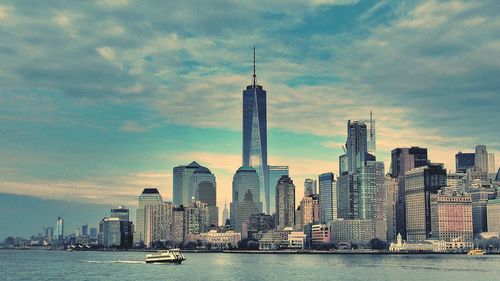 City skyline against cloudy sky