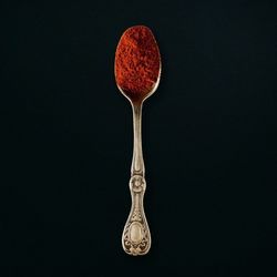 Close-up of wineglass against black background