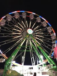 Low angle view of illuminated ferris wheel