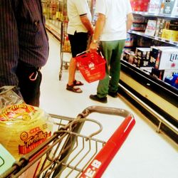 Low section of people standing at market