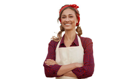 Portrait of a smiling young woman against white background