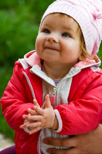 Close-up of cute baby girl looking up