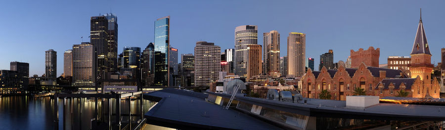 View of skyscrapers against clear blue sky