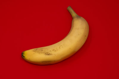 Close-up of bananas against red background