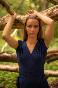 Portrait of young woman standing outdoors