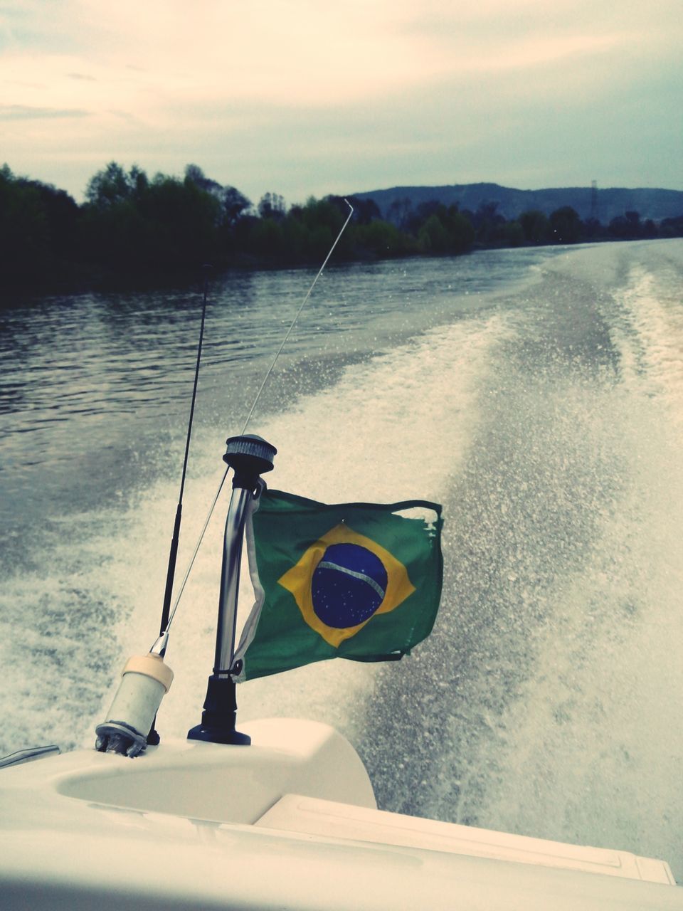 transportation, water, nautical vessel, mode of transport, boat, sky, sea, tranquility, tranquil scene, mountain, nature, lake, beauty in nature, river, scenics, moored, outdoors, day, beach, no people