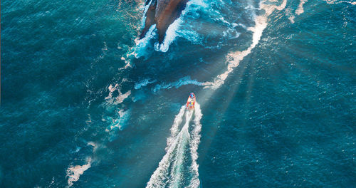 High angle view of boat sailing in sea