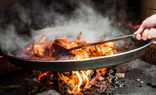 Close-up of hand preparing food in kitchen