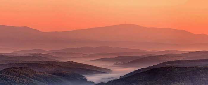 Scenic view of mountains against sky during sunset