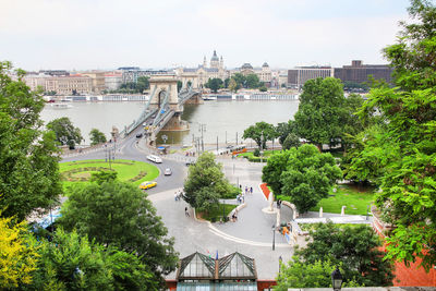 High angle view of bridge over river against buildings