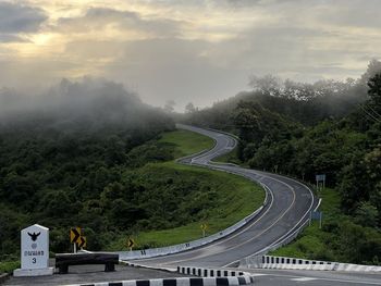 High angle view of road amidst mountains against sky