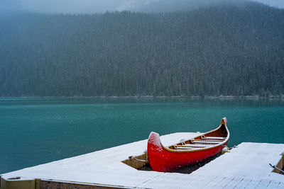 Boat moored on lake