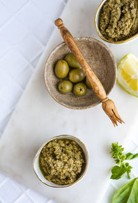 High angle view of olives in bowl on table