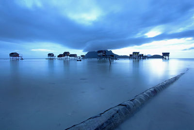 Scenic view of sea against cloudy sky