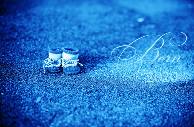 Close-up of wedding rings on the ground