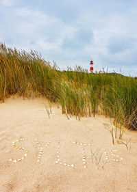 Scenic view of beach against sky