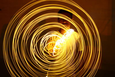 Close-up of wire wool with man in background