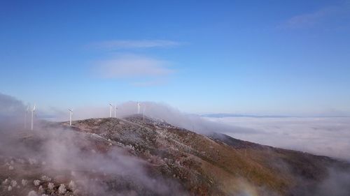 Scenic view of landscape against blue sky