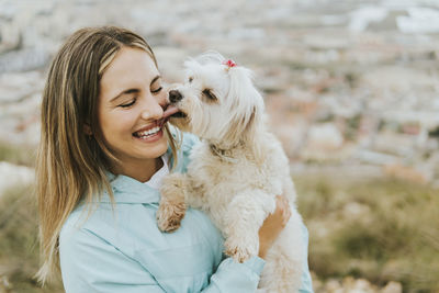 Portrait of young woman with dog