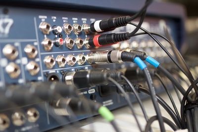 Close-up of cables connected to amplifier