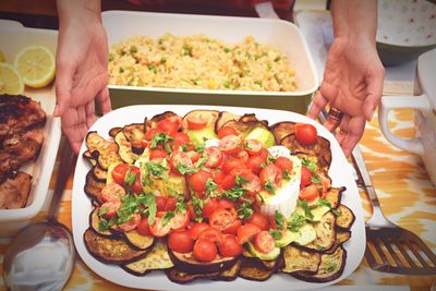 Cropped image of hand holding food