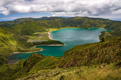 Scenic view of lake and mountains against sky